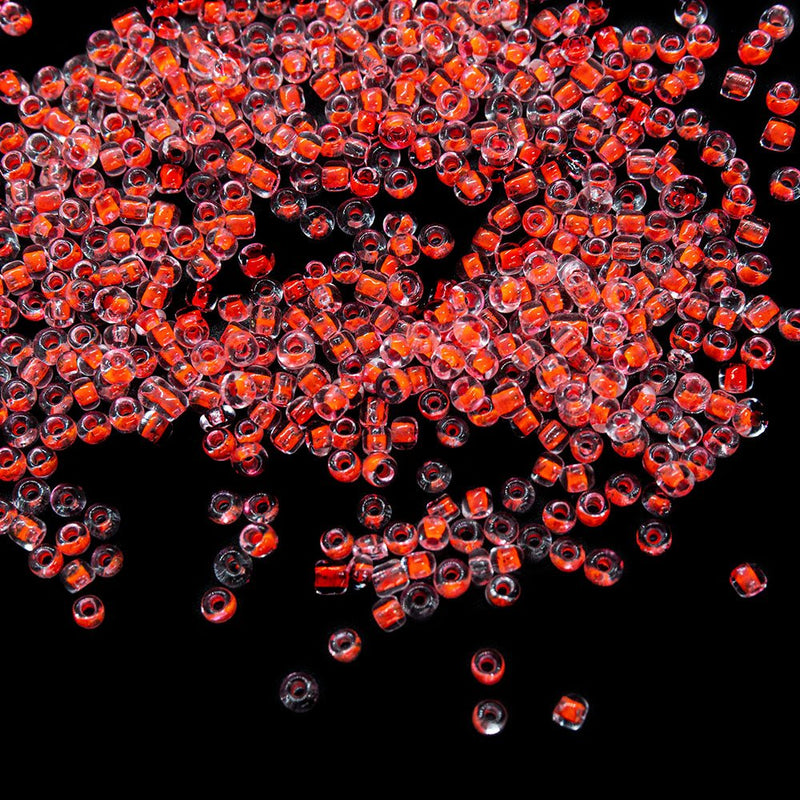 Load image into Gallery viewer, Transparent Colour Lined Seed Beads 11/0 Fluorescent Pink - Affordable Jewellery Supplies