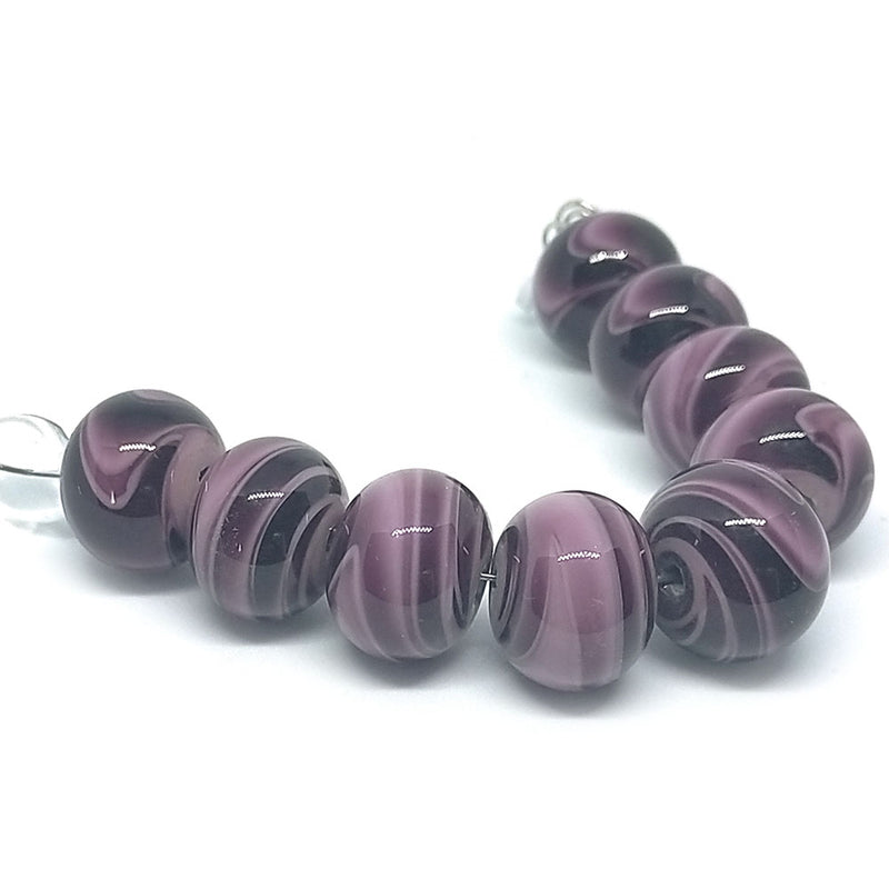 Load image into Gallery viewer, GlaesDesign Handmade Lampwork Swirl Beads 17mm x 12mm Amethyst & Black - Affordable Jewellery Supplies
