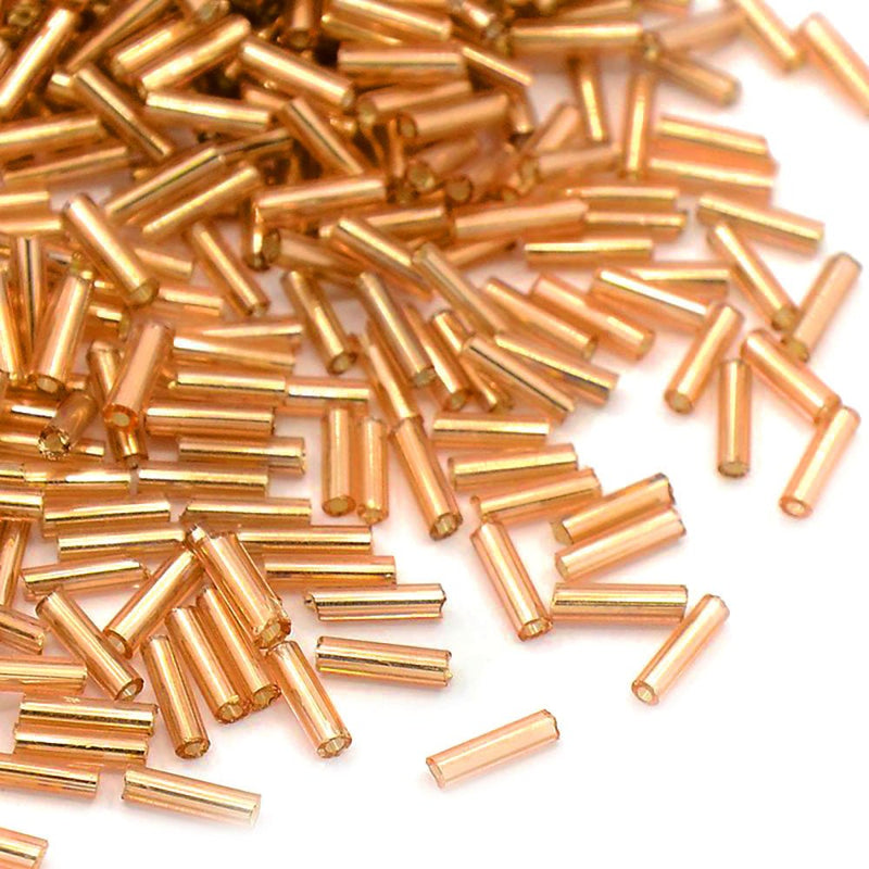 Load image into Gallery viewer, Silver Lined Glass Bugle Bead 6mm x 1.8mm Wheat - Affordable Jewellery Supplies
