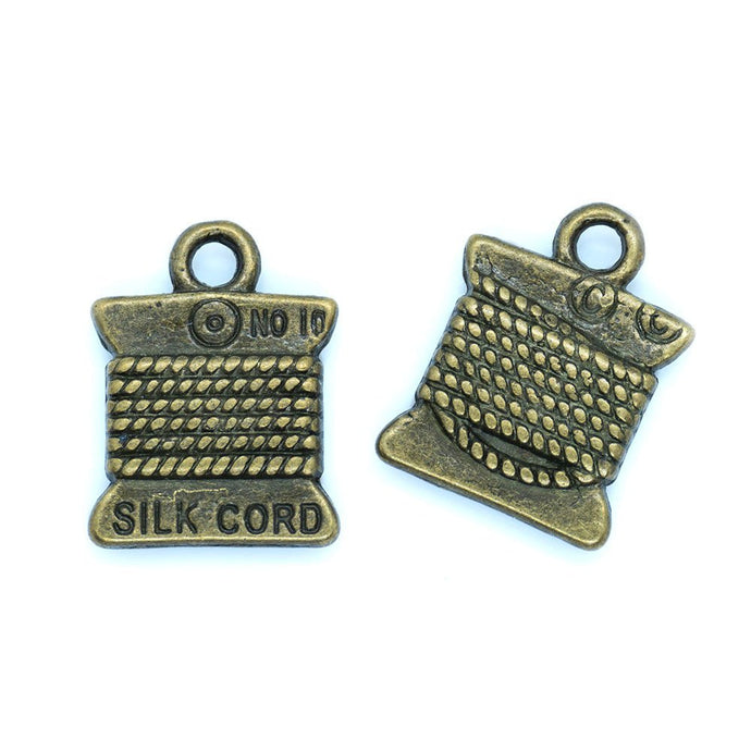 Silk Cord Spool Charm 15mm x 10mm Antiqued Bronze - Affordable Jewellery Supplies