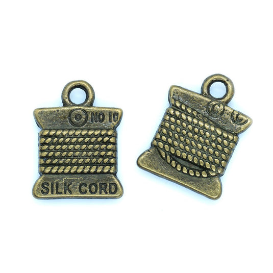 Silk Cord Spool Charm 15mm x 10mm Antiqued Bronze - Affordable Jewellery Supplies